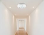 1 LEAP 1L-PS01 PIR motion sensor detector mounted on the ceiling in the corporate office for automatic motion detection.